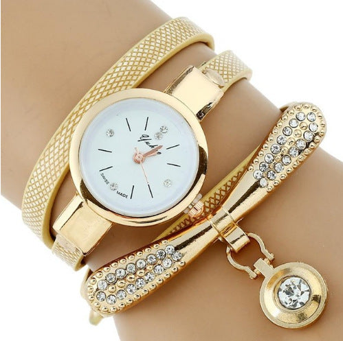Gold Rhinestone Bracelet Watch with sparkling rhinestones and polished gold finish on a wrist.
