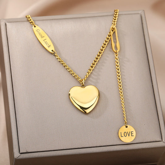 Multilayer Heart & Moon Necklace displayed in a jewelry box featuring heart and charm pendants.